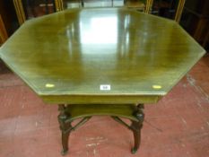 A circa 1900 octagonal topped mahogany table with turned spindle supports, shaped under tier