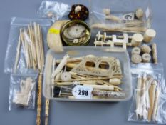 A large parcel of small ivory items, bobbins, discs, pair of table clamps, miniature containers etc