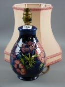 A Moorcroft pottery 'Clematis' lamp base, cobalt blue ground with painted and impressed factory