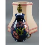 A Moorcroft pottery 'Clematis' lamp base, cobalt blue ground with painted and impressed factory