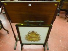 An oak work table hinged stand and an oak framed firescreen with dried flower panel