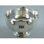 A circular silver pedestal bowl with Celtic style border, 10 ozs, London 1918