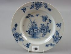 A circular Lambeth blue and white Delft plate, 23 cms diameter (two very early staples underneath