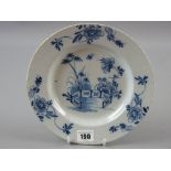 A circular Lambeth blue and white Delft plate, 23 cms diameter (two very early staples underneath