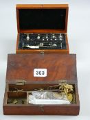 A mahogany cased set of balance scales and a chromium set of weights for precious metals with