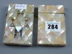 A small mother of pearl card case with diamond shaped decoration and a mother of pearl and abalone