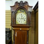 A Victorian mahogany longcase clock, the hood with broken swan neck pediment and central carved swag