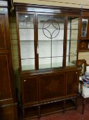 An excellent circa 1900 crossbanded mahogany display cabinet, single central door with satin lined