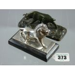 A silver plated model of Leo of Lion of MGM Pictures set on an ebonized stepped base with