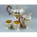 An attractive heavy four piece silver tea and coffee service, each piece of neat proportions with