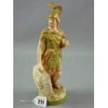 A Royal Dux figurine of a standing warrior with shield to a circular base, 26 cms high