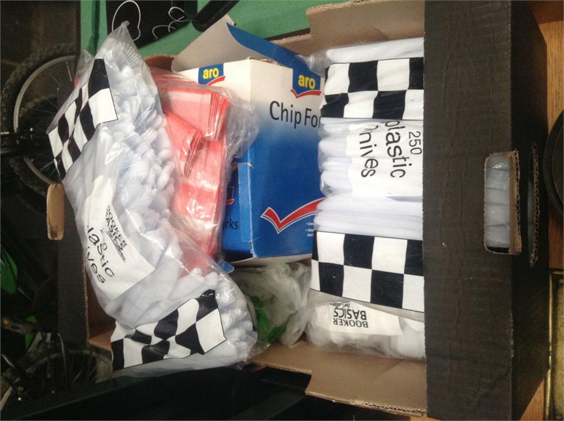 One box of plastic cutlery, plastic bags, Woden chip forks