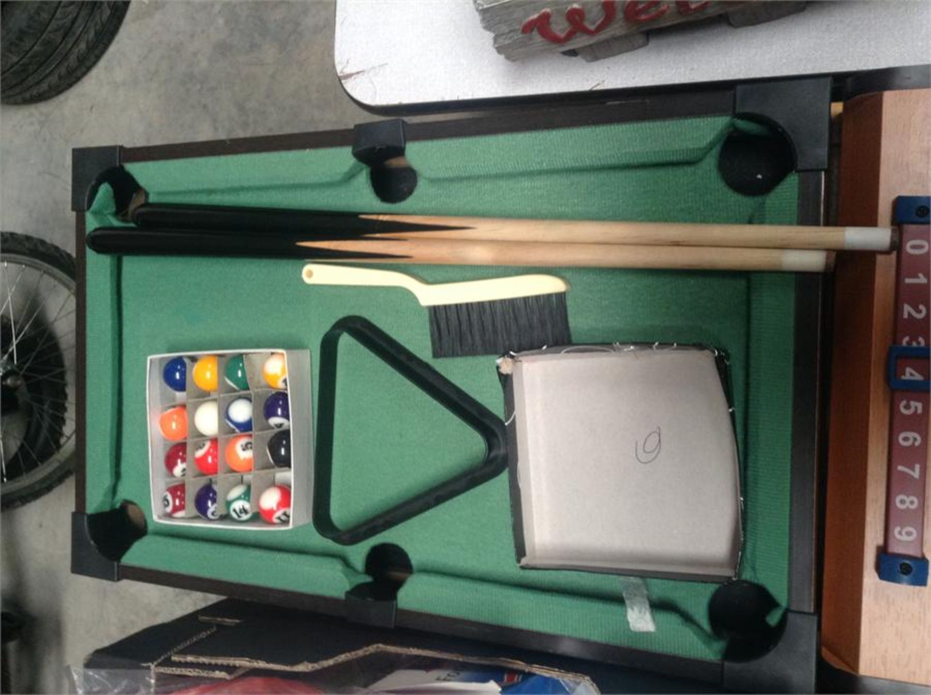 One table top pool set inc balls and two cues