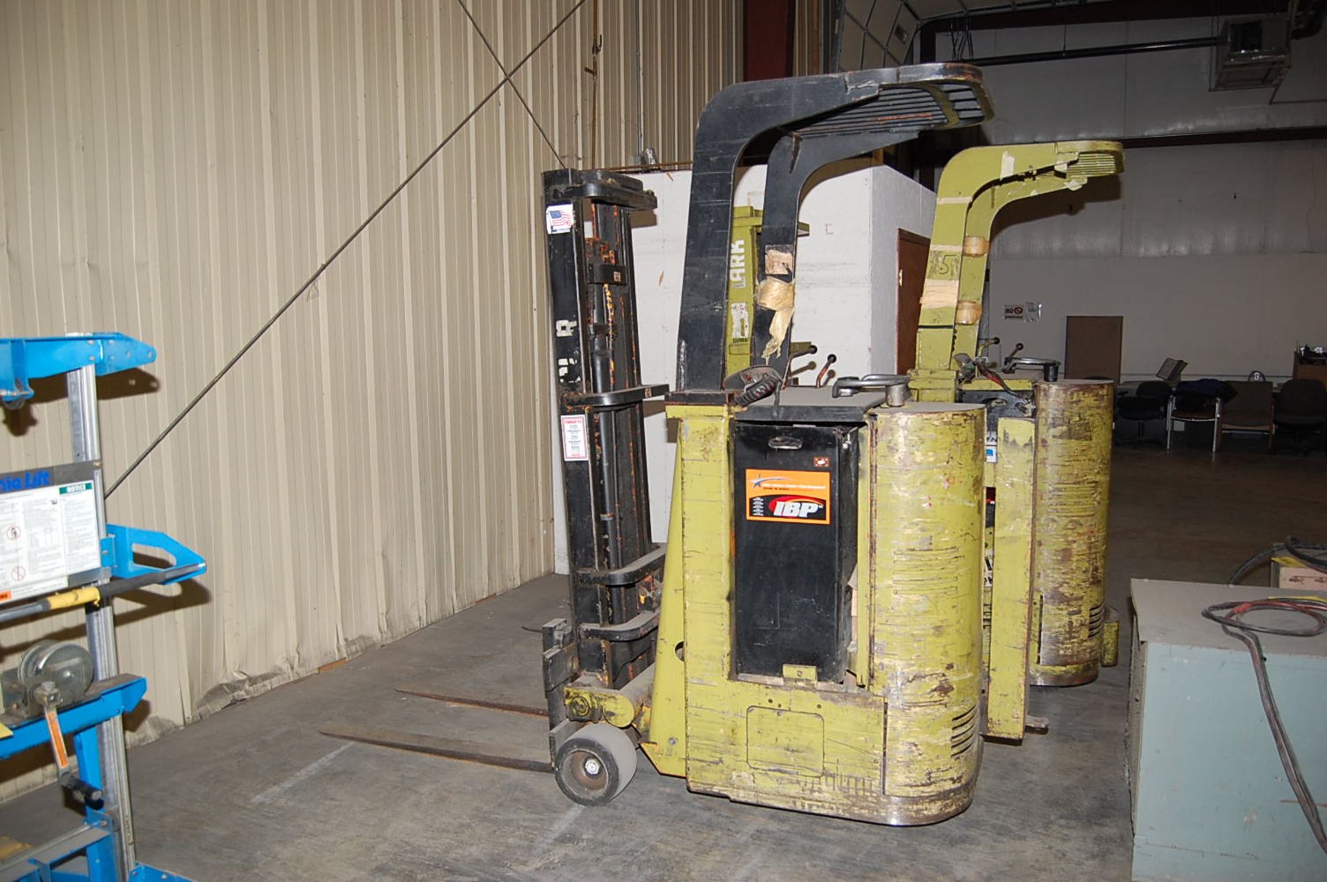 Clark Model #NST-25 Stand Up Rider Electric Fork Lift Rated 2150 lb. Capacity, 130 in. Lift