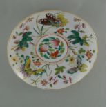 Famille Rose dish, ca. 1900  D. 18.5 cm, H. 2.5 cm. Flat dish with slightly bended walls and