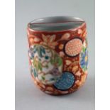 Porcelain tea cup, ca. 1900  H.6.5 cm, D. 5.5 cm. Cup with thin wall, above thin cross-bar. Imari-