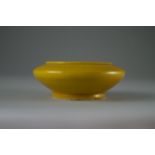 Small brush washer, Daoguang 1850-90  D. 8cm, H. 3.5cm. Yellow slightly iridescent glaze with fine