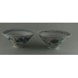 Two porcelain bowls, 20 century  H. 6.8 cm. Underglaze blue and red décor, grey glaze with