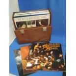 A record case of vinyl LP records including Bob Dylan, Fairport Convention, Joni Mitchell etc