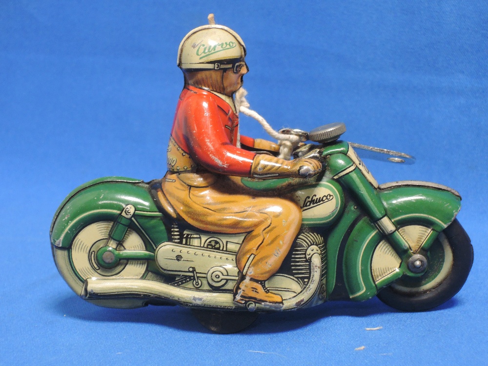 A 1950's Schuco tin plate and clockwork motorcycle with rider Curvo 1000 with key - Image 2 of 2