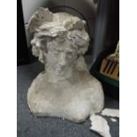 A cast concrete figure modelled as a classical maiden