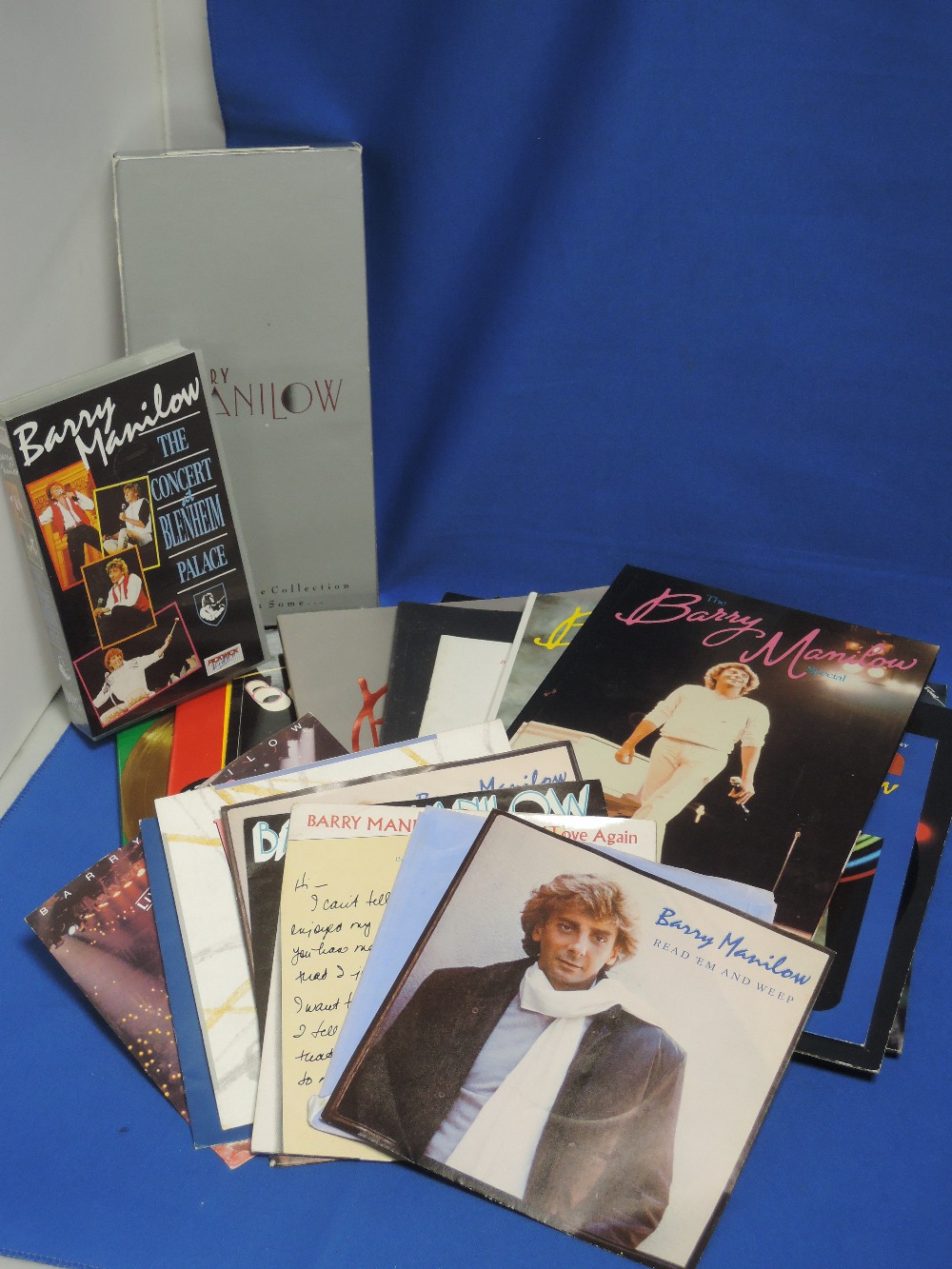 A selection of Barry Manilow singles, Cds and brochures etc