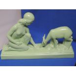 A 1930's Art Deco mantel figure modelled as green naked woman and fawn