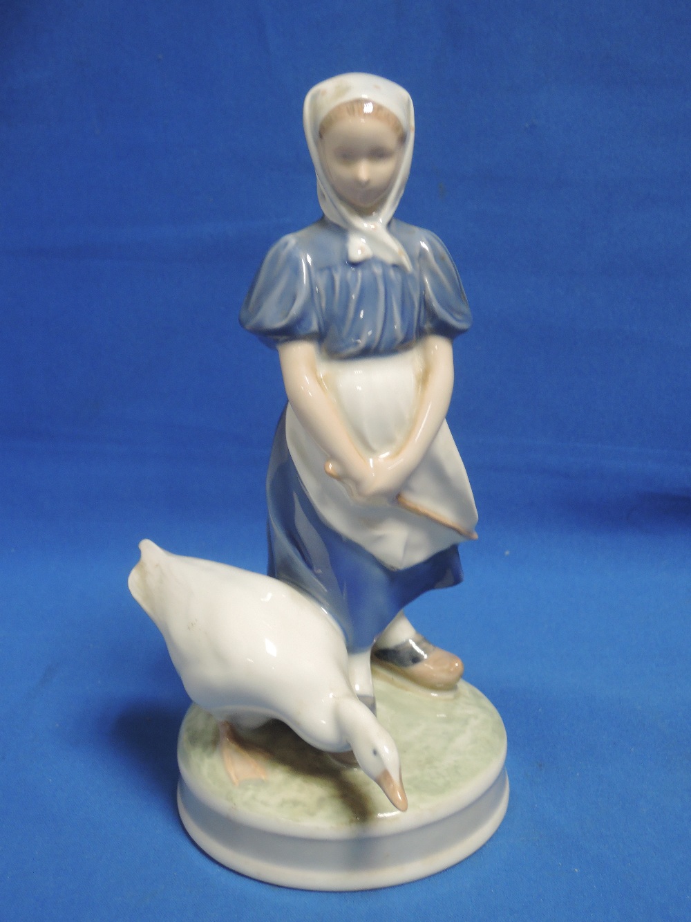 A Royal Copenhagen figure modelled as Girl with goose 527