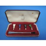 A cased silver cigarette holder with interchangeable mouthpieces, Birmingham 1962, Alfred