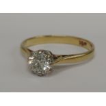 A ladies diamond solitaire dress ring, approx .5ct on a yellow metal loop stamped 18ct