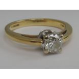 A ladies diamond solitaire ring, approx .45ct in a raised square claw set mount  with diamond chip