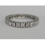A ladies diamond full eternity ring having 24 brilliant cut stones, approx 1.2ct in a white metal