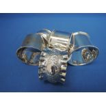 Four HM silver napkin rings of various forms, approx 80g, and a plated one,