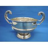 A silver rose bowl on circular pedestal foot with moulded scroll handles, (AF), Birmingham 1923,