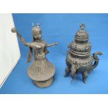 A white metal figurine modelled as an Oriental dancer, possibly an oil burner, stamped 900, and a