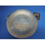 An Indian silver and copper overlaid brass charger having extensive decoration, a small pair of HM