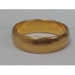 A 22ct gold wedding band,  approx 5.6g