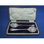 A cased pair of silver fruit spoons having shaped bowls, Sheffield 1915, James Deakin & Sons