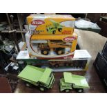 Four Joal diecast construction vehicles, two boxed and a Cararama 1/50 scale diecast low loader with