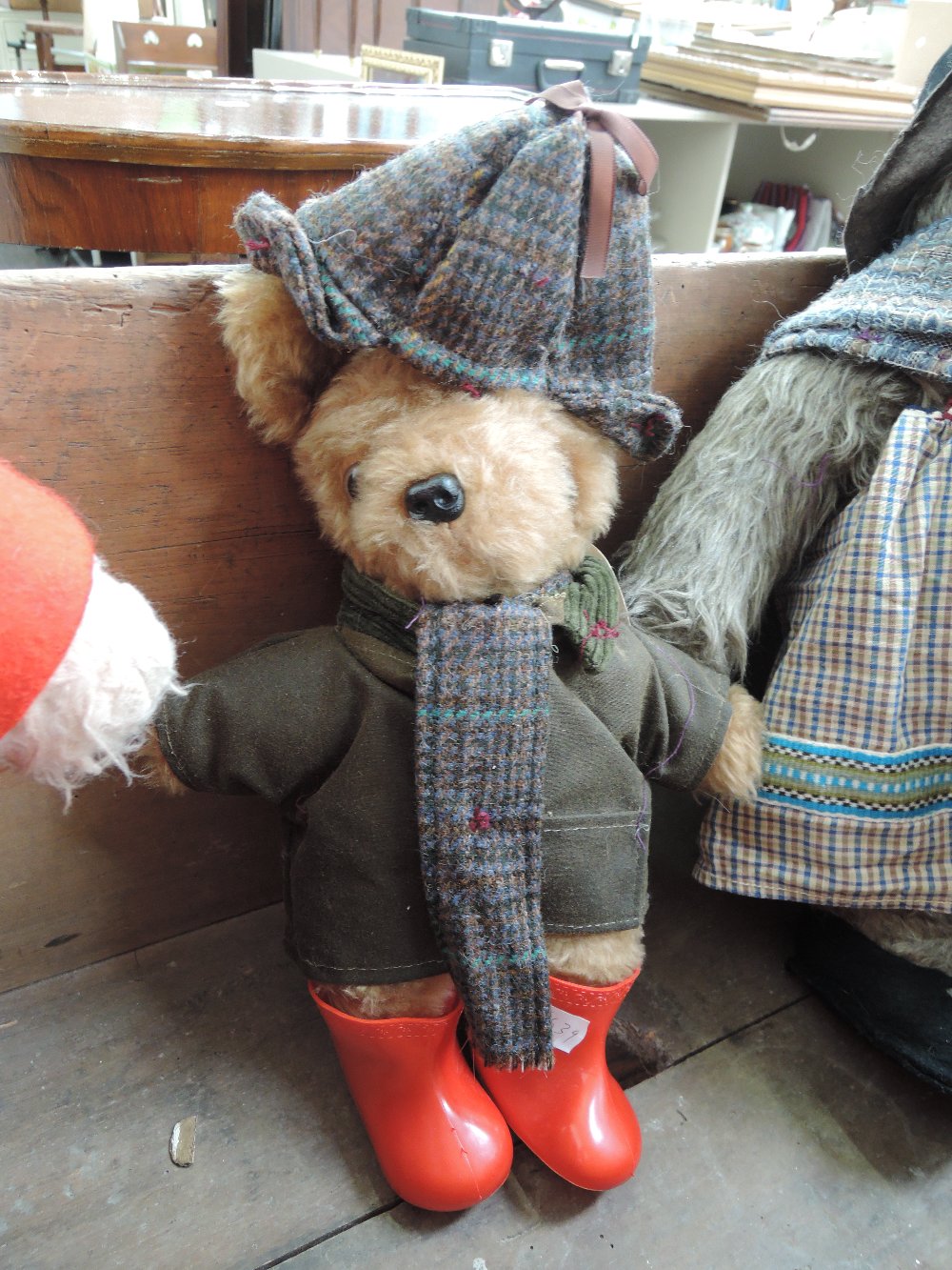 A Laura Grant bear wearing jacket, hat, scarf and wellingtons