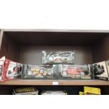 Three Burago 1/18 scale diecast vintage racing cars and two Corgi 1/18 scale diecast McLaren and