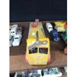 A Shackleton diecast and clockwork Foden flatbed wagon having yellow cab and body, red wheel arches,