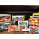 A shelf of mixed diecast cars including; Burago, Shell etc, most boxed