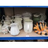 A shelf of decorative ceramics, including jugs etc