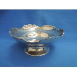 A silver bowl of plain form having a moulded scalloped rim and a circular pedestal foot, Sheffield