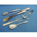 A small selection of HM silver including sugar nips, preserve spoon, silver handled shoe horn and