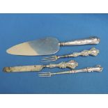 Three pieces of HM silver handled flatware including cake slice, Edwardian child's set and a white