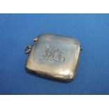 A silver vesta case of plain form having initials JHA to front,  Birmingham 1911, makers marks worn