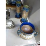 A pair of Royal Doulton spill vases of typical form having blue and brown glaze and a matching tyg