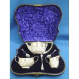 A cased silver bachelors tea set comprising tea pot, creamer and sucre, having gadrooned